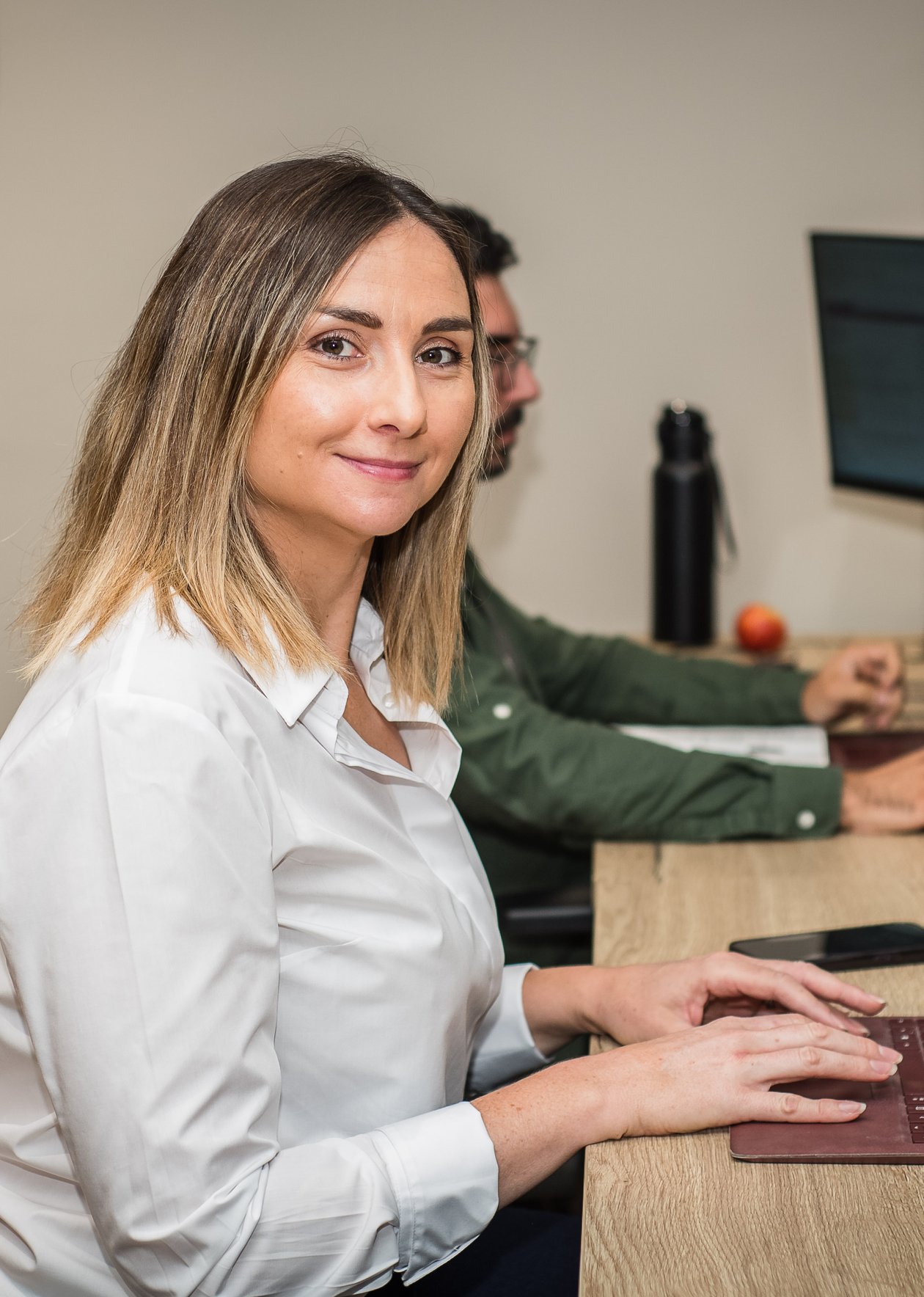 Becky smiling at the camera