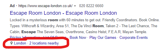 a location extension circled on a google ad